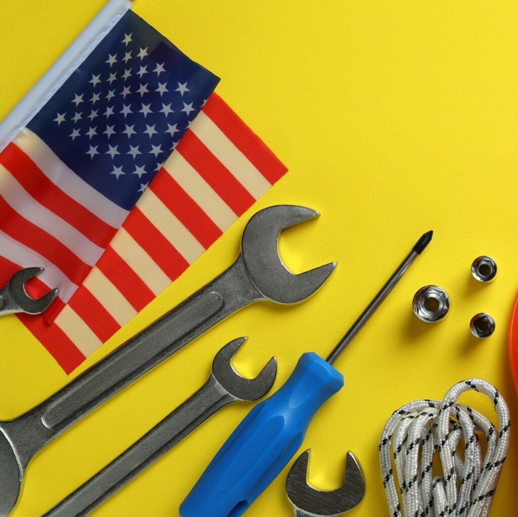 Concept of Happy Labor Day with different accessories on yellow background